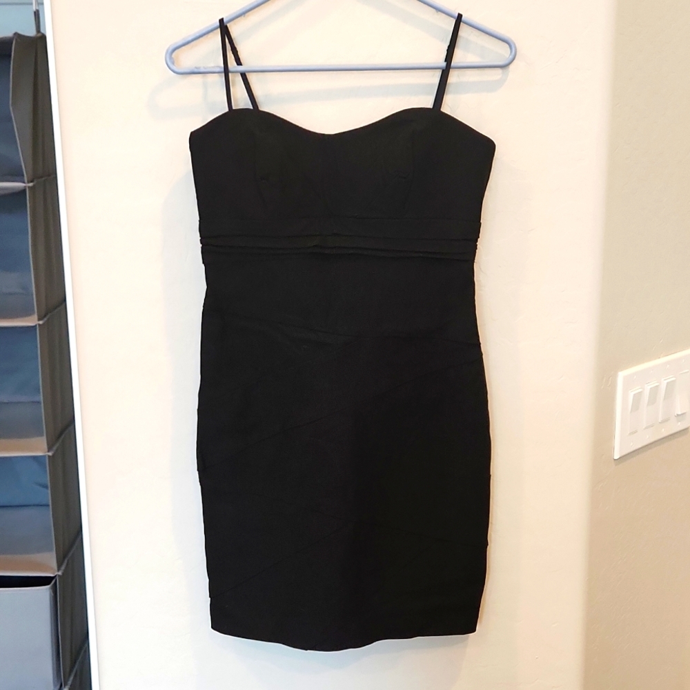 Black party dress size large. Slim fit, above knee, stretch material. Ruby Rox.